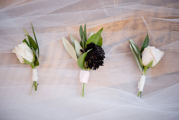 White and burgundy boutonnières 