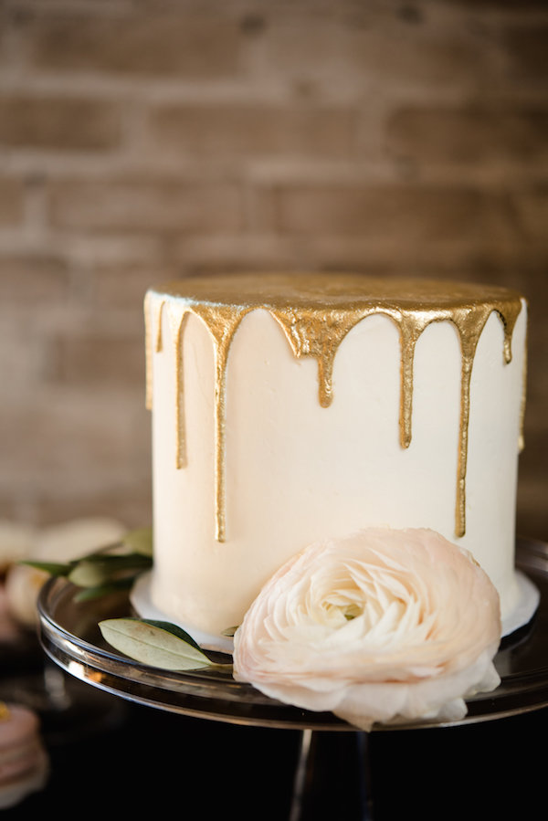 A gold drip wedding cake