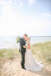 Bride and groom on Lake Michigan beach