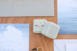 Light blue velvet ring box with wedding ring