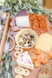 Fresh charcuterie board on wooden cheese board