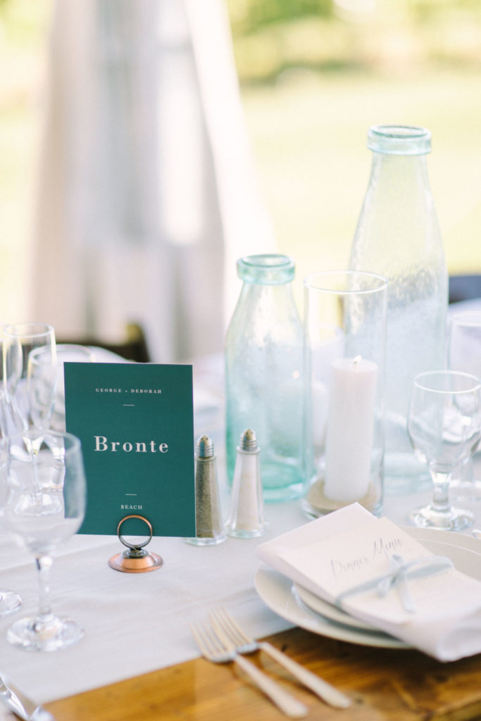 Blue sea glass table decor at a 12 Corners Vineyard Wedding