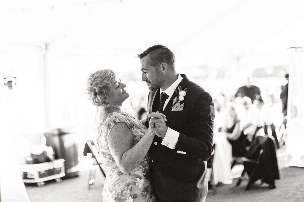 Groom shares a dance with her mother at his 12 Corners Vineyard Wedding