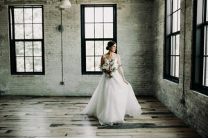 Bride with her bouquet at a Journeyman Distillery wedding