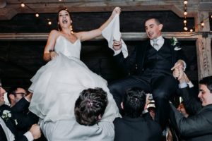 Bride and Groom enjoying the Hora at a Journeyman Distillery wedding