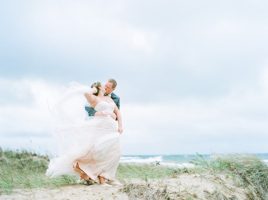 Bride and groom on the beach at their Lake Michigan wedding