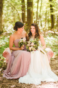Bride and bridesmaid laughing at a Long Lake Outdoor Center Wedding