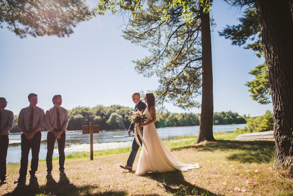 Bride and her father walking down the aisle at a Long Lake Outdoor Center wedding