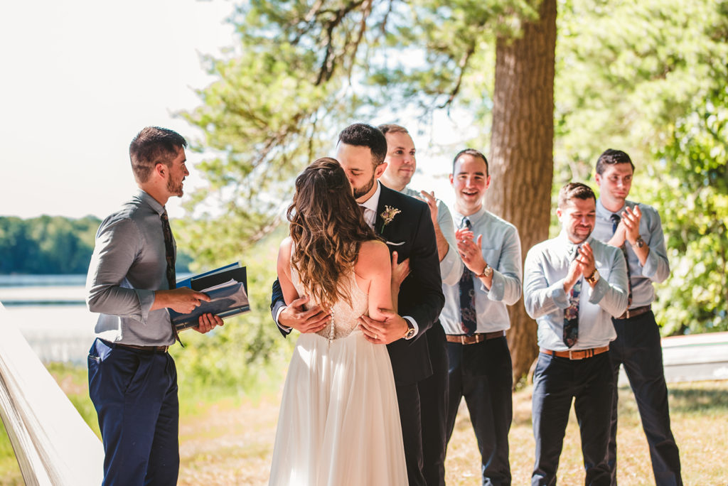 The Groom kisses the Bride during their wedding ceremony