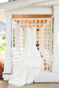 dress hanging before a Bay Pointe Inn wedding