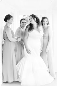 Bride and bridesmaids getting ready before a lakeside wedding in Shelbyville, Michigan