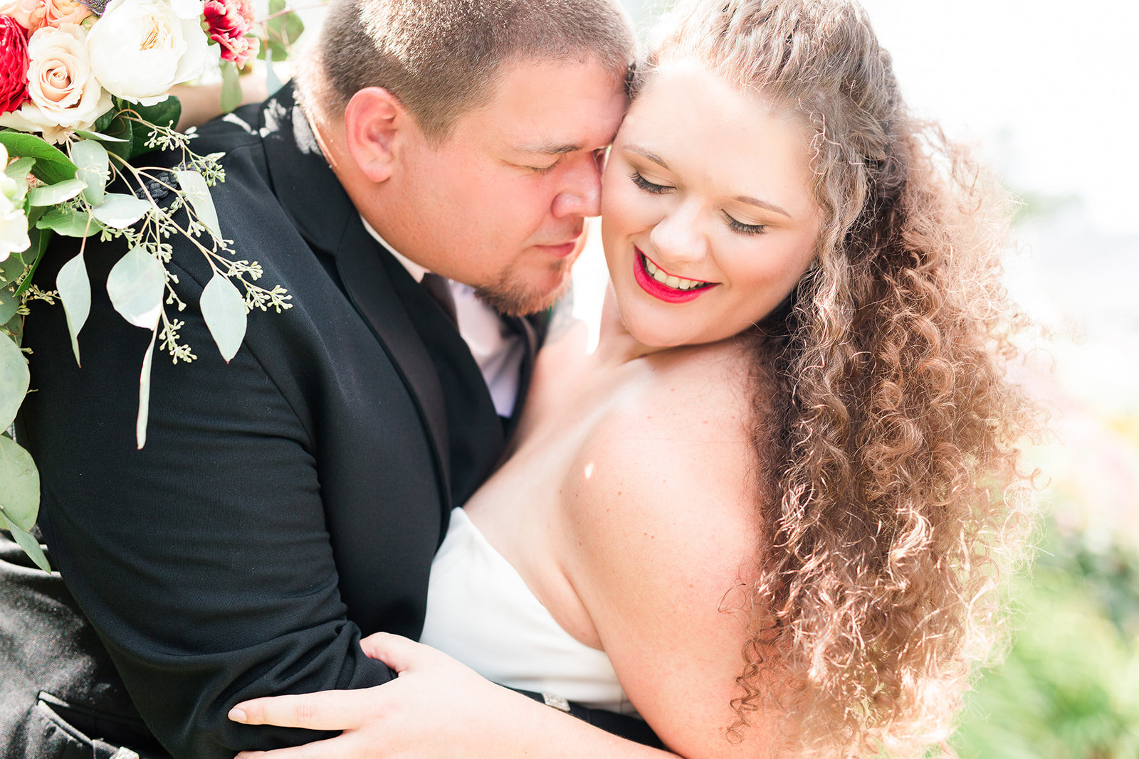 Bride and groom hugging and smiling