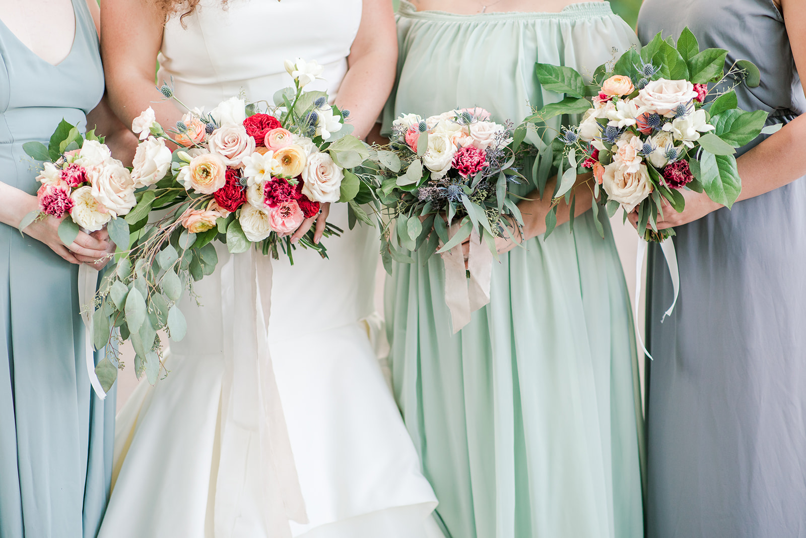 Bride and bridesmaids bouquets before a Bay Pointe Inn wedding in Shelbyville, Michigan