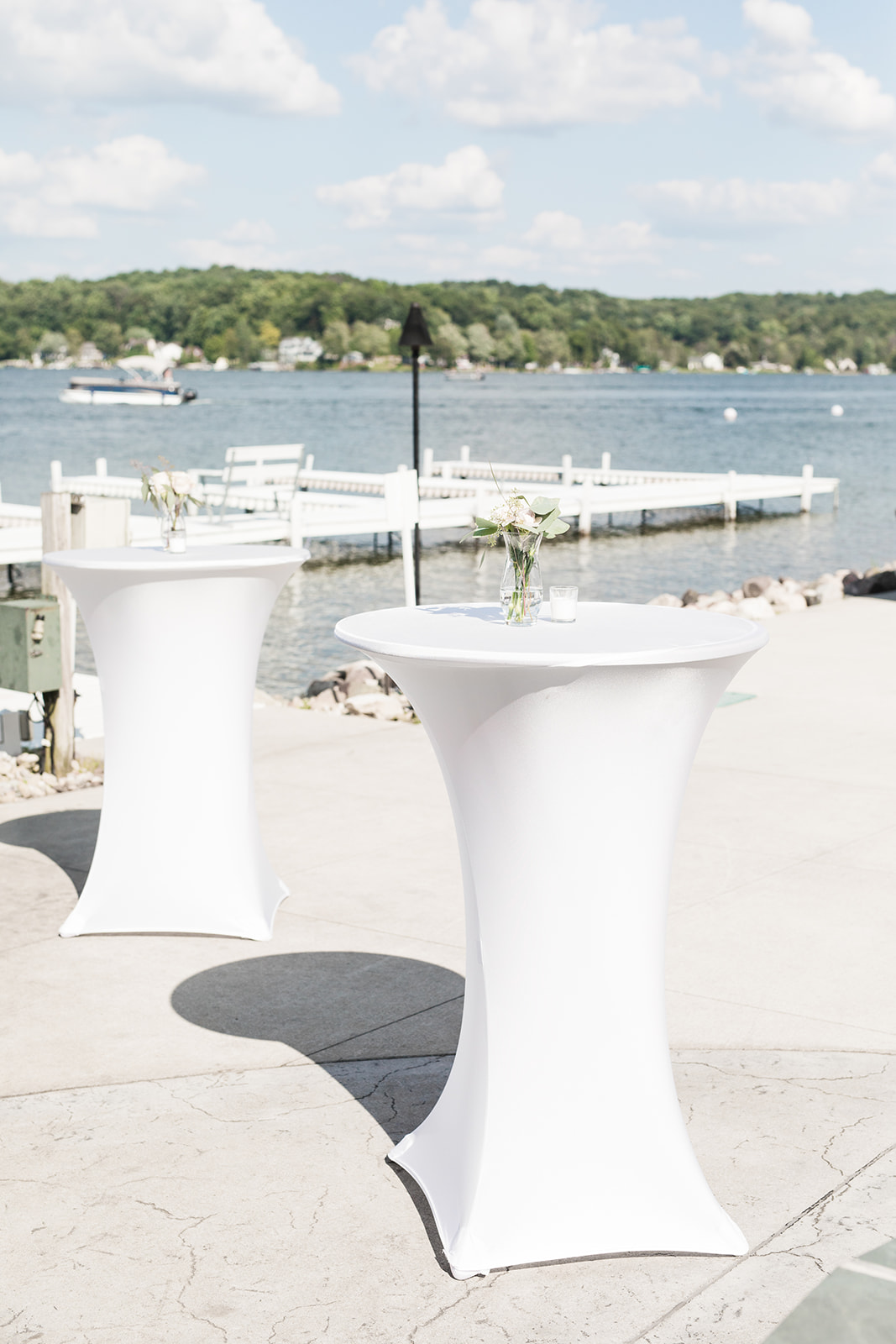 Cocktail tables set for a lake wedding venue in Michigan wedding