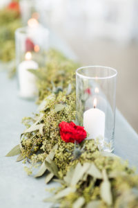 Candles and a greenery garland