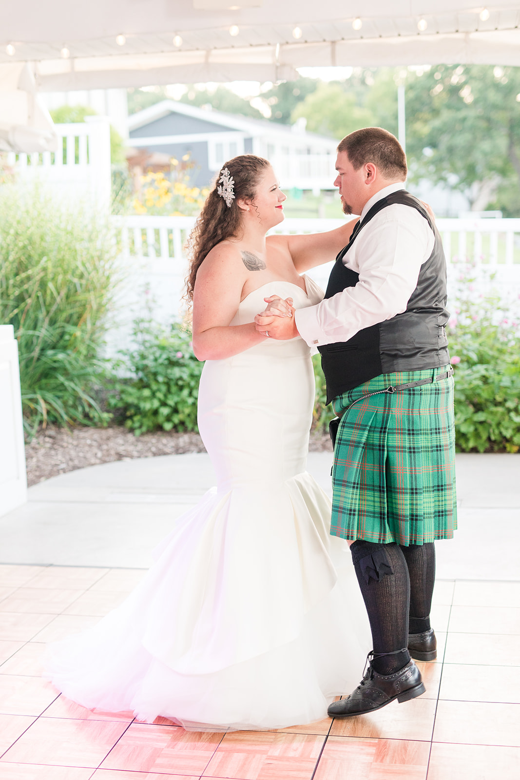 Bride and groom sharing their first dance at their Bay Pointe Inn wedding in Shelbyville, Michigan
