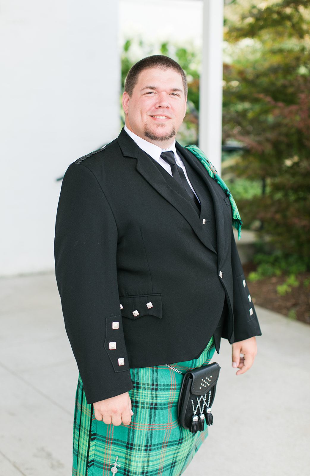 Groom dressed in traditional Scottish kilt 