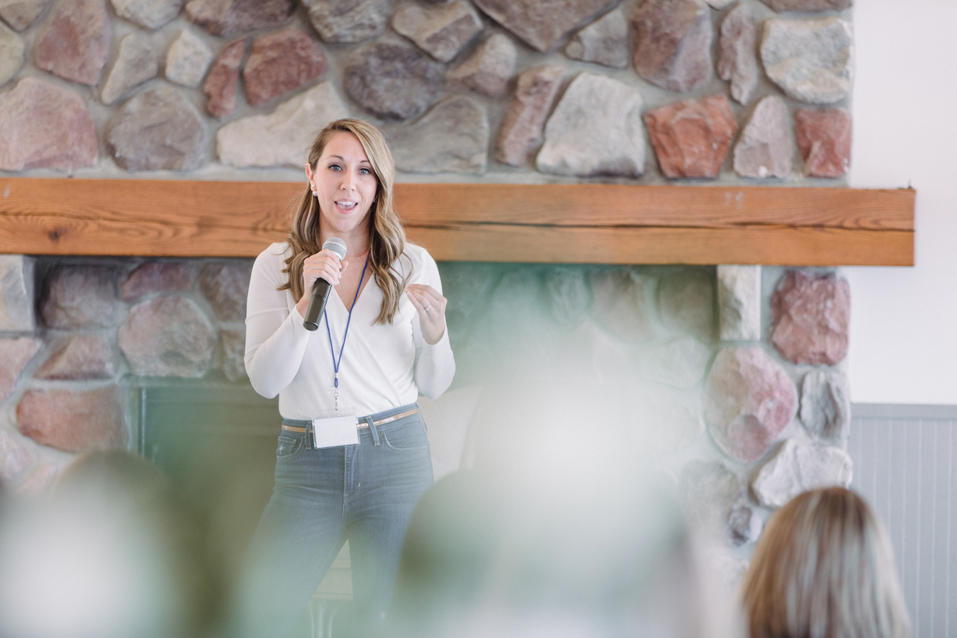 Brooke DePauw on stage speaking at The Haven Conference in West Olive, Michigan