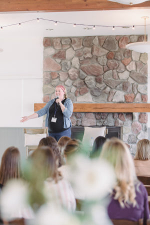 Kalin Sheick on stage speaking at The Haven Conference in West Olive, Michigan