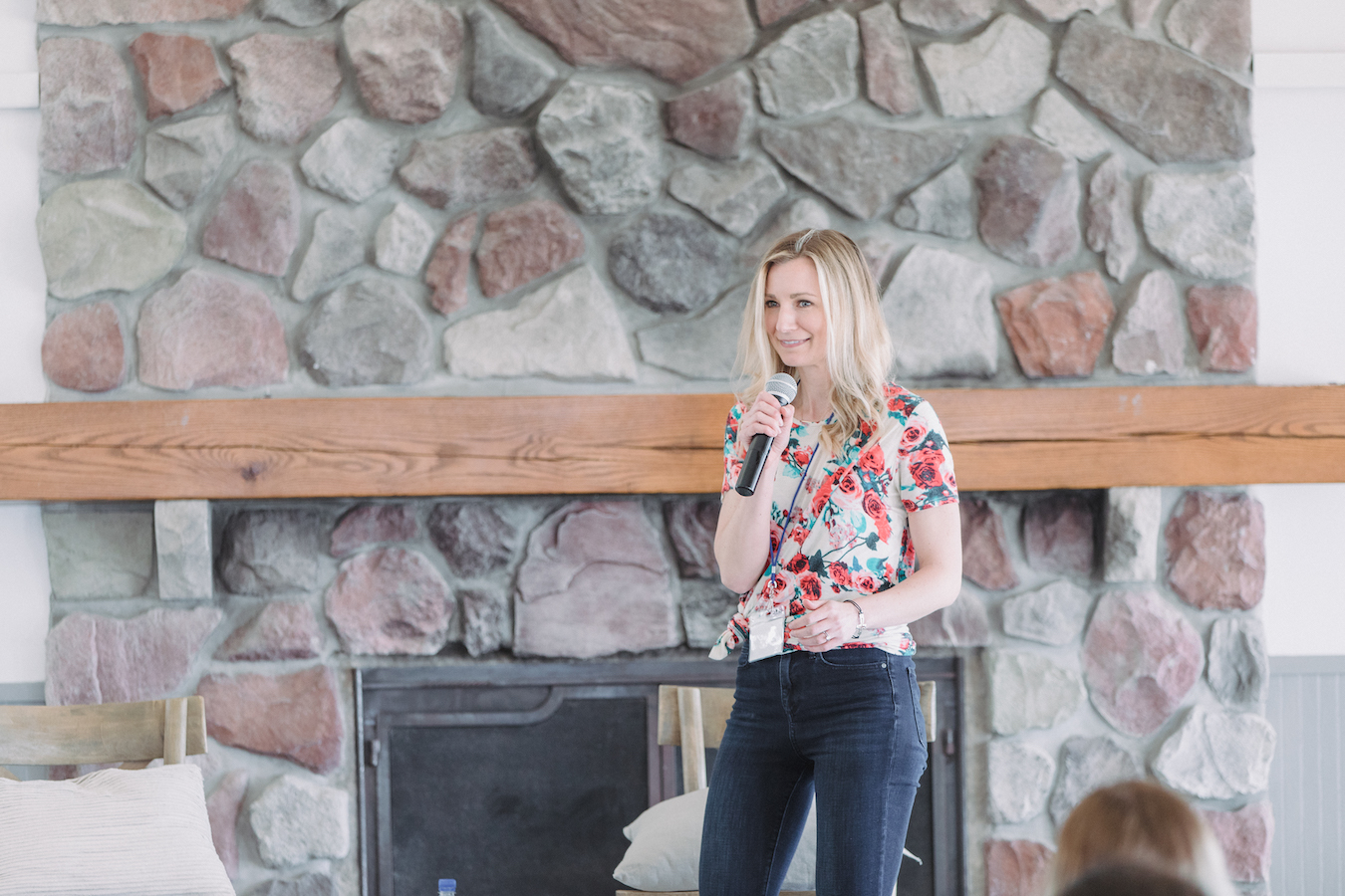 Brittney Suttle on stage speaking at The Haven Conference in West Olive, Michigan
