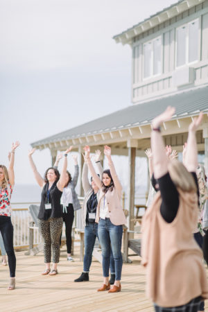 Attendees doing an exercise outside at Camp Blodgett in West Olive, Michigan during The Haven Conference