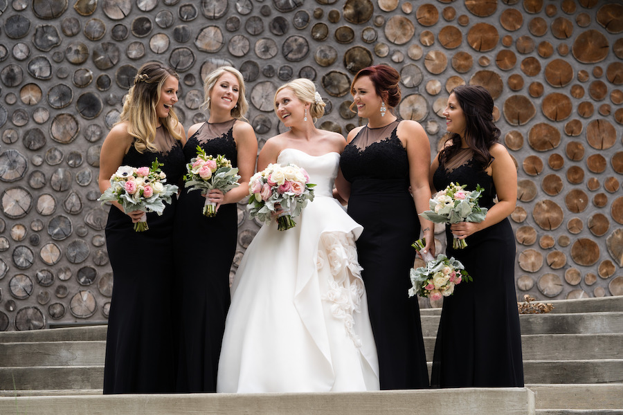 A bride and her bridesmaids smiling before her Kalamazoo, Michigan wedding