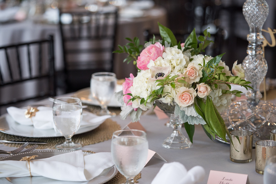 A table set with flowers during a Loft 310 wedding
