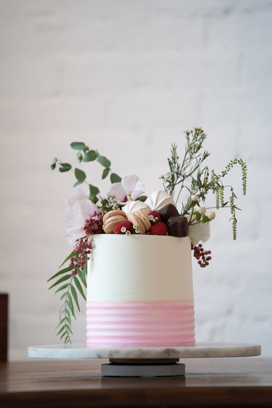 A fun pink and white cake at a Loft 310 wedding