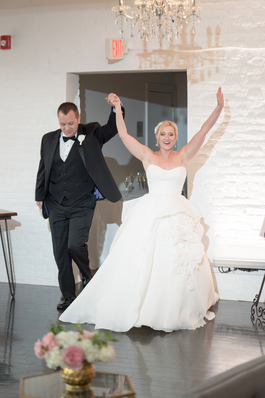 A bride and groom being introduced into their Loft 310 wedding reception
