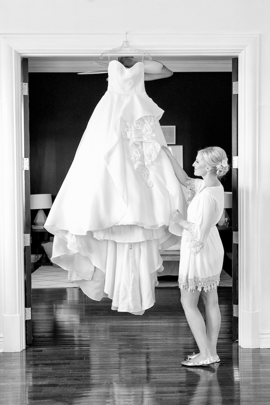 A bride fixing her dress the morning of her wedding
