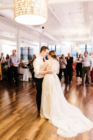 A couple shares their first dance during their Loft 310 wedding in Kalamazoo, Michigan