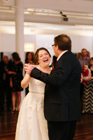 A father and a bride share a dance during a loft 310 wedding