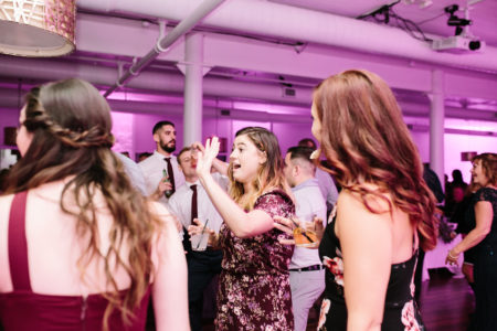 A group of people dancing during a Loft 310 wedding