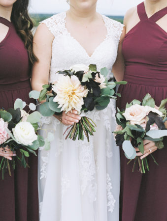 Bride and bridesmaids with their dahlia wedding bouquets