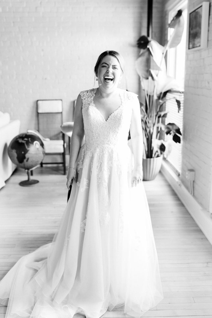 A bride smiling in her wedding dress in Kalamazoo, Michigan