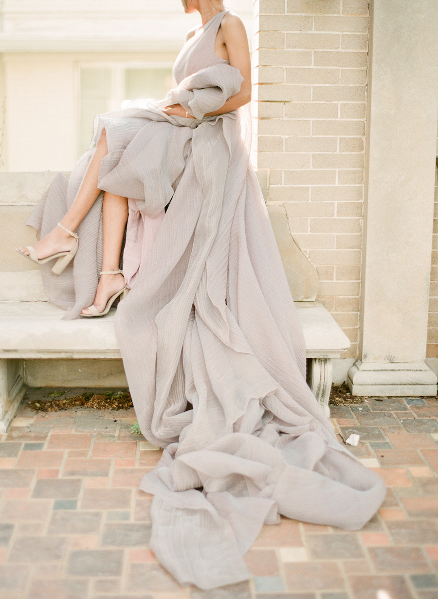 A bride holding her wedding dress