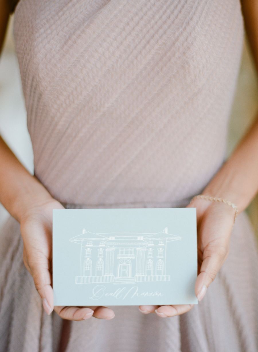 Bride holding her wedding invitation 