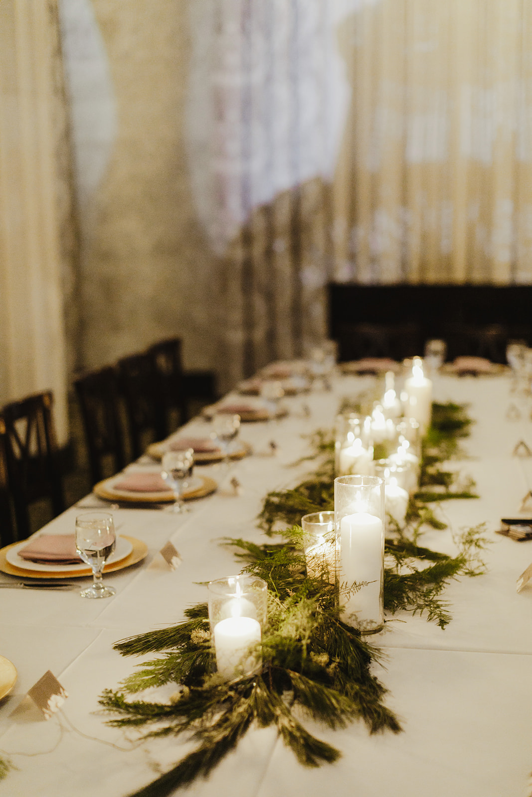 A beautiful head table set-up with candles for a Ballroom at McKay wedding