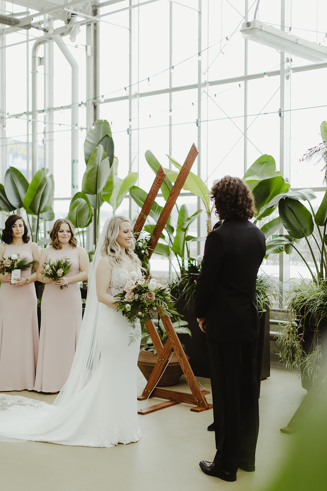 A couple smiling during their Downtown Market Grand Rapids wedding