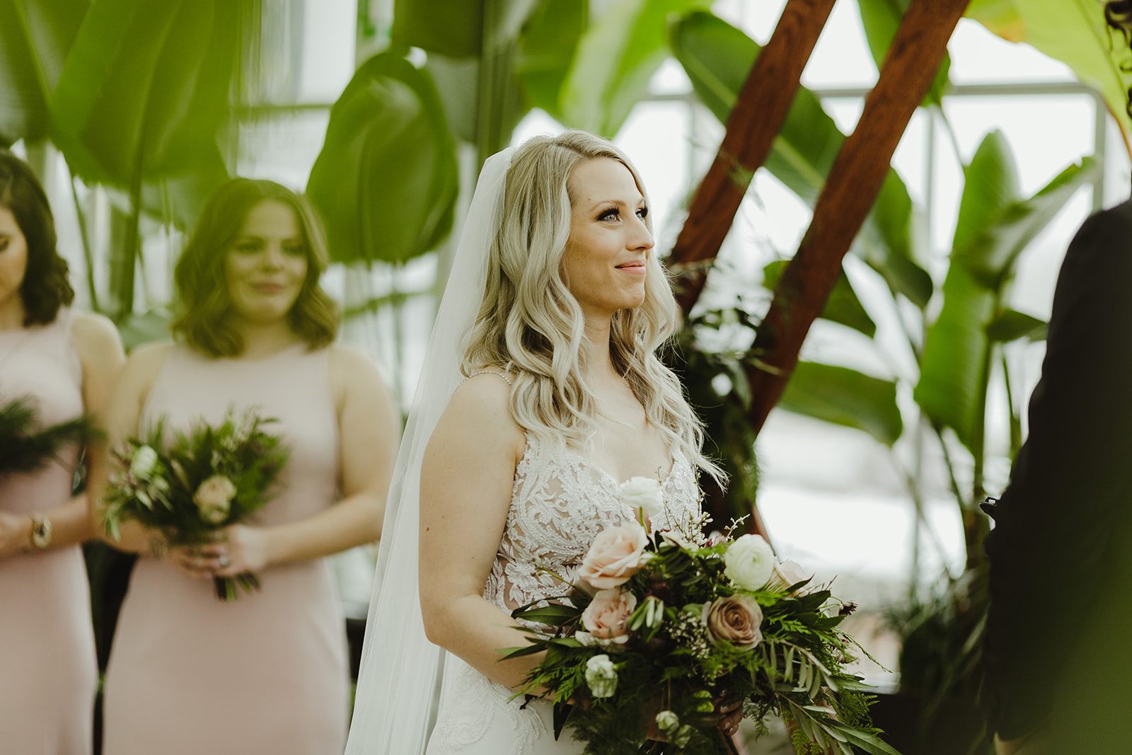 A bride smiling during her wedding ceremony in Grand Rapids, Michigan