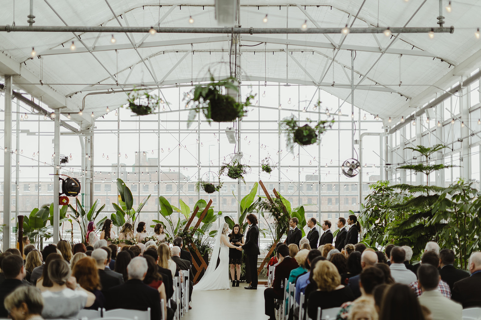 Guests enjoying a ceremony during a Downtown Market Grand Rapids wedding