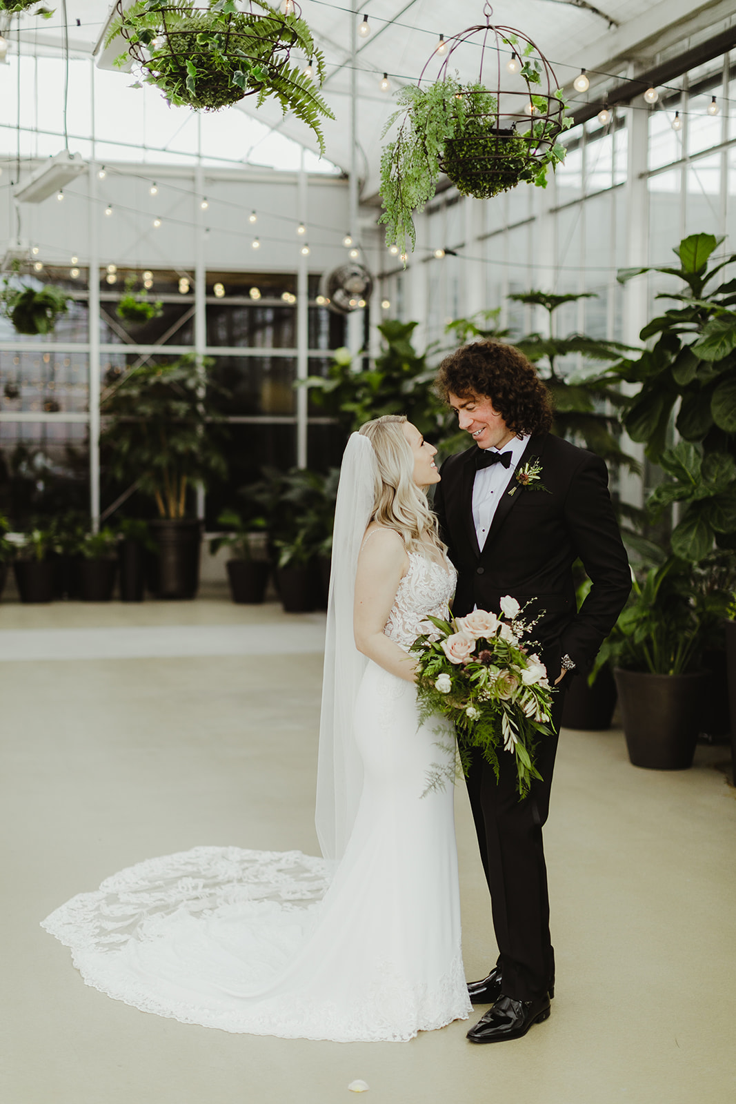 A couple smiling after their Downtown Market Grand Rapids wedding