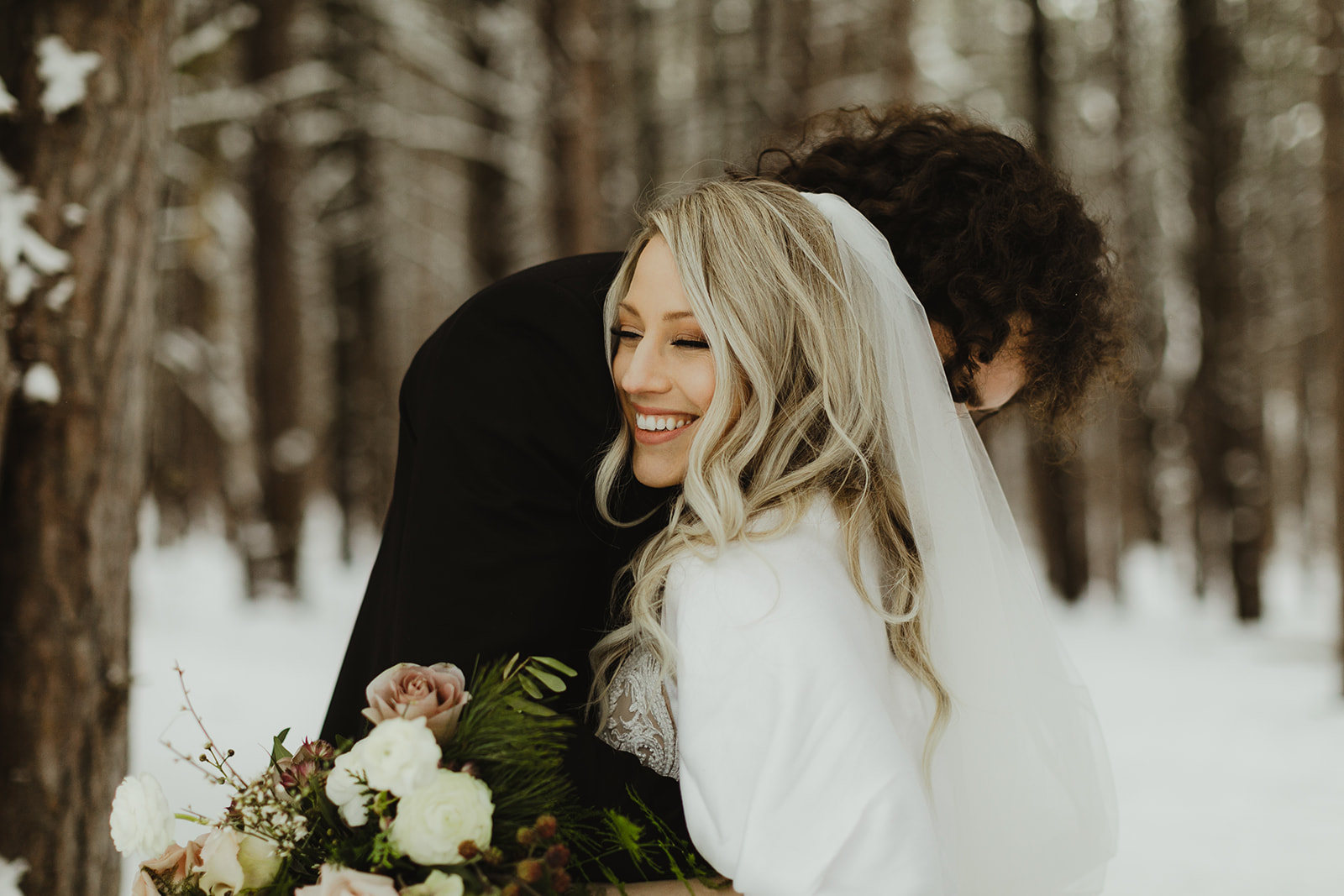 A bride and groom hugging after their Grand Rapids, Michigan wedding