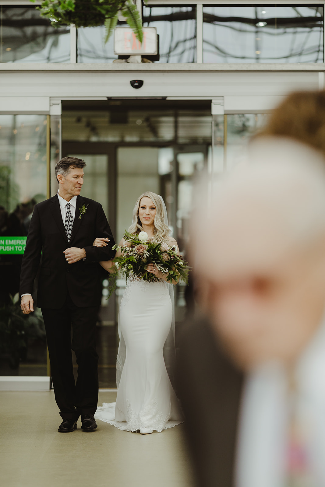 A bride and her father walking down the aisle