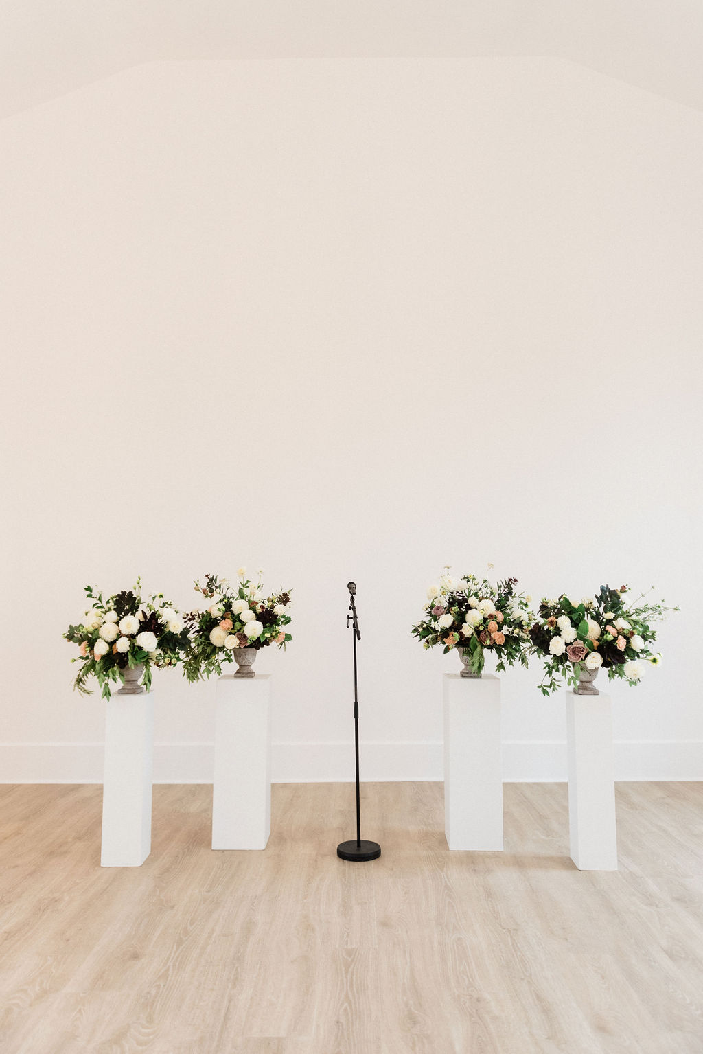 Floral arrangements set at the alter of a Loft 310 Chapel wedding