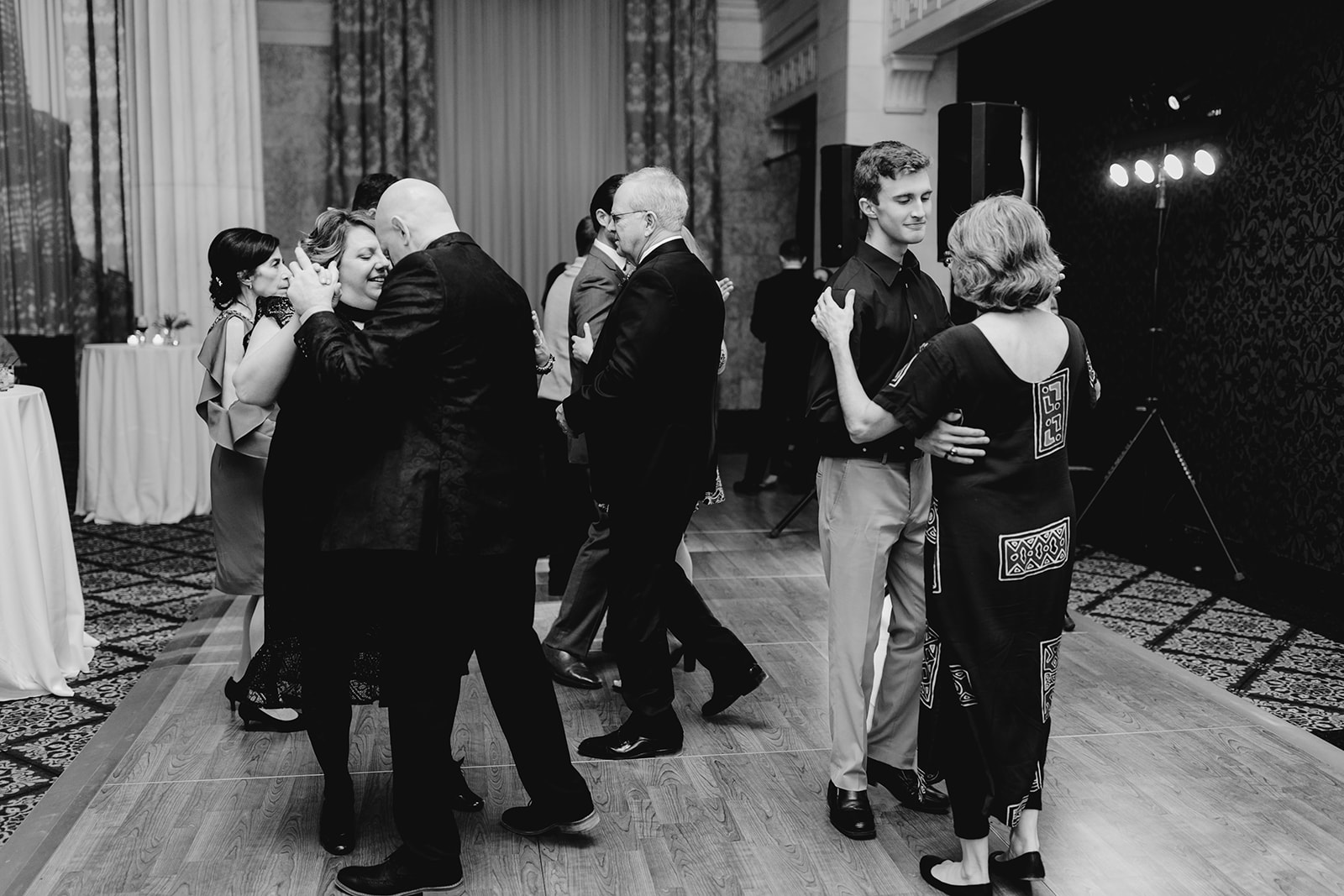 Guests dancing on the dance floor at a wedding reception 