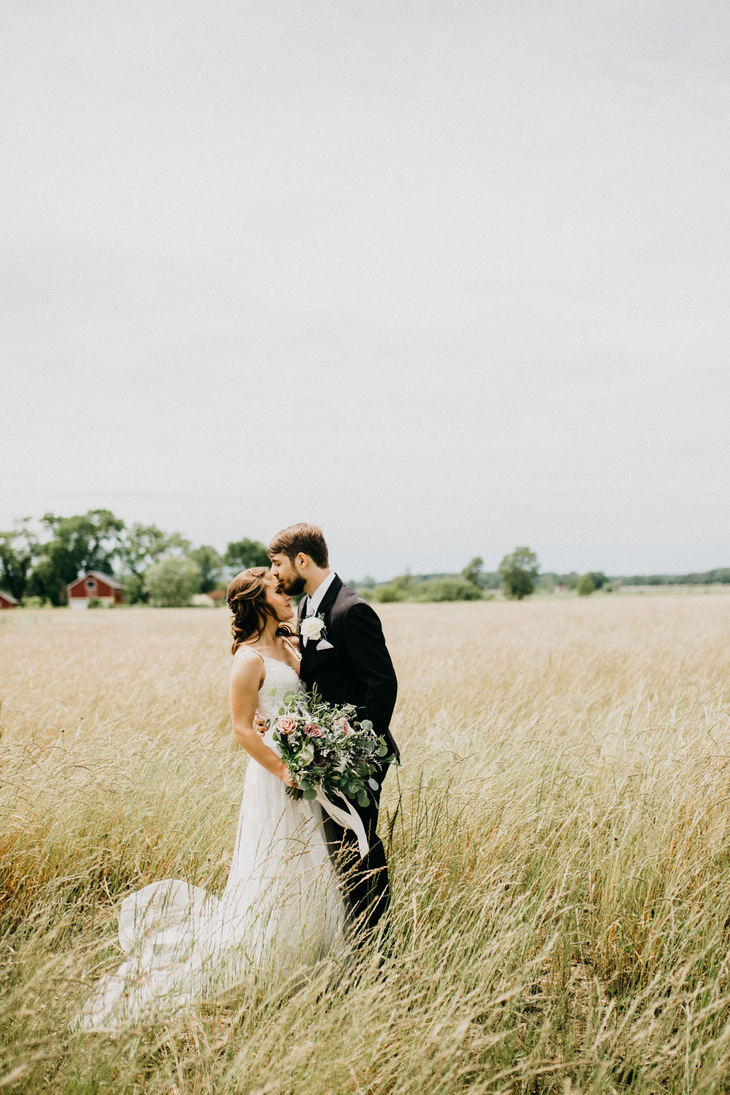 A couple kissing after their wedding