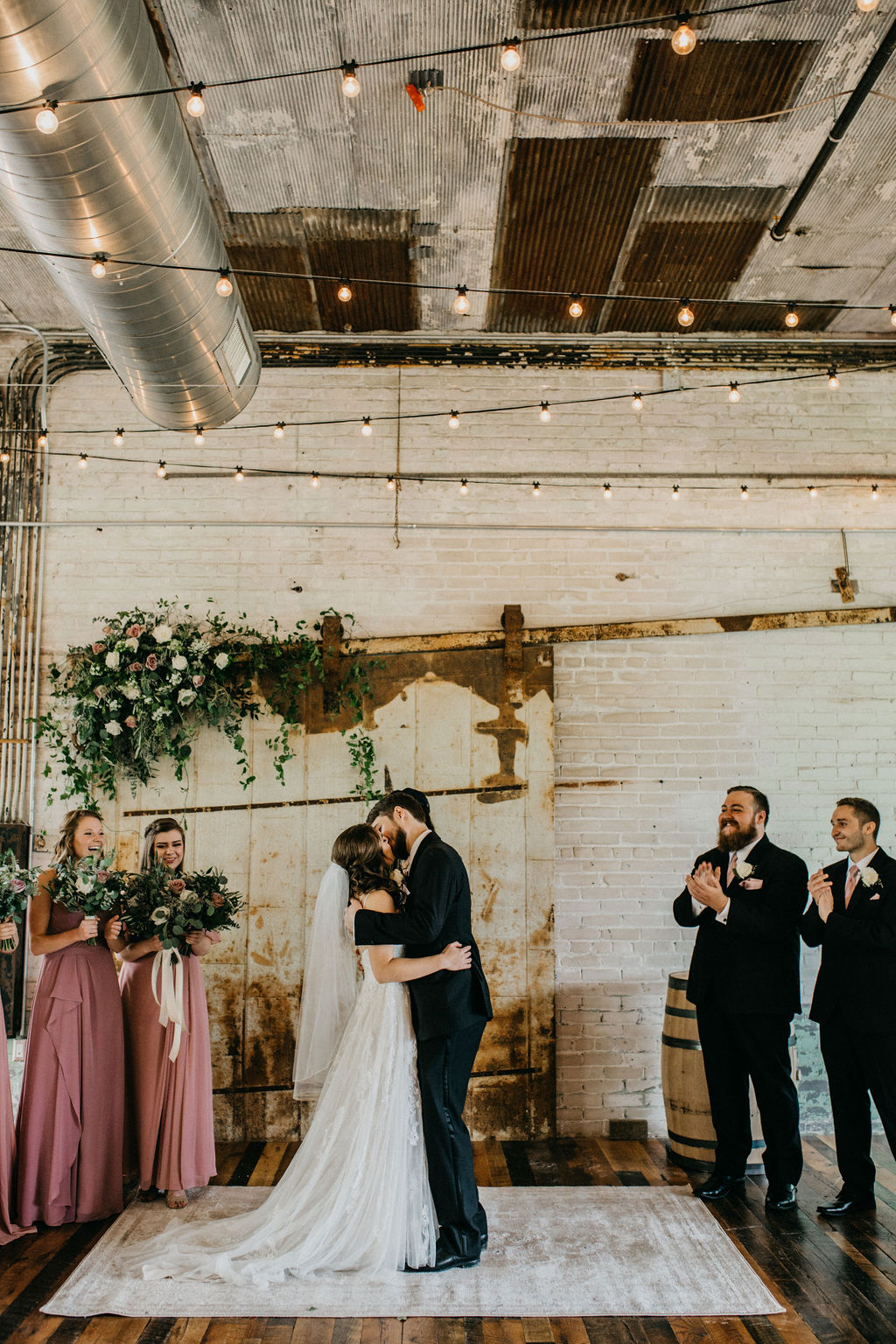 A couple kissing after becoming husband and wife