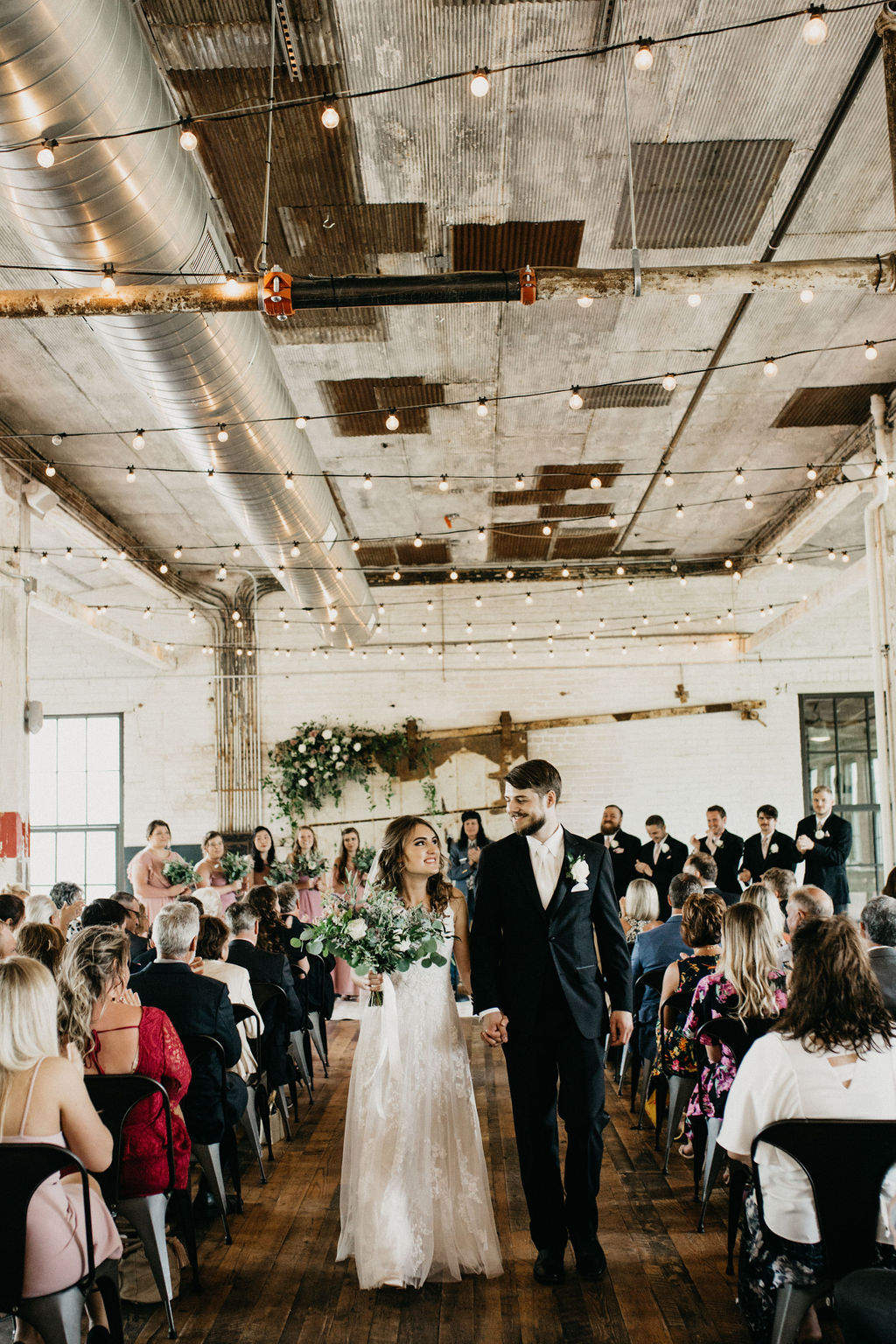 A couple smiling after their wedding