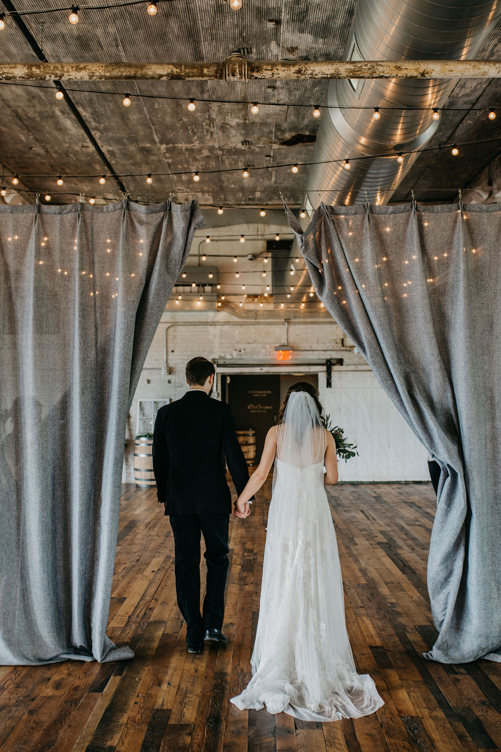 A couple recessing from their wedding ceremony